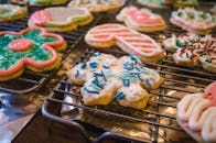 Deliciously decorated Christmas cookies cooling on a rack, perfect for the holiday season.